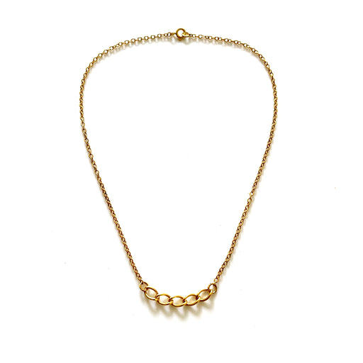 Close-up of the 18ct gold plated curb chain pendant on a delicate oval link chain by Roberts & Co