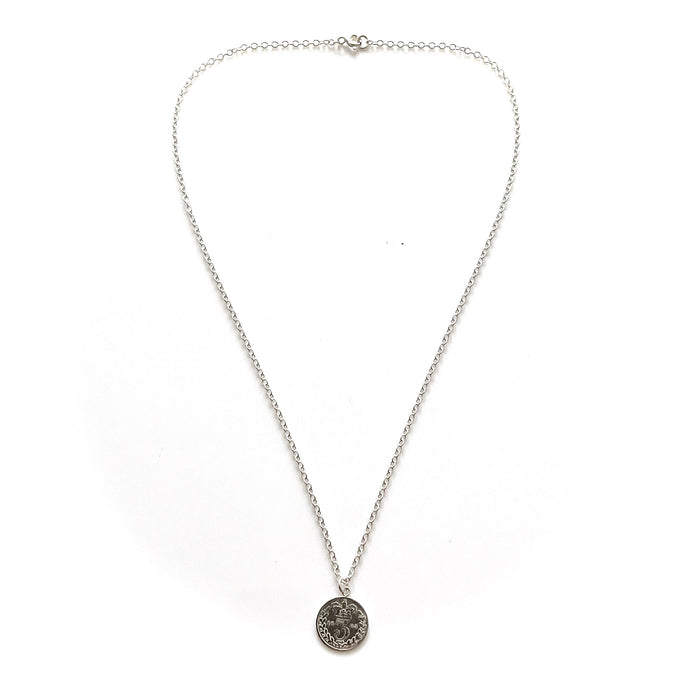 Sophisticated sterling silver necklace featuring a historic 1883 British three pence coin