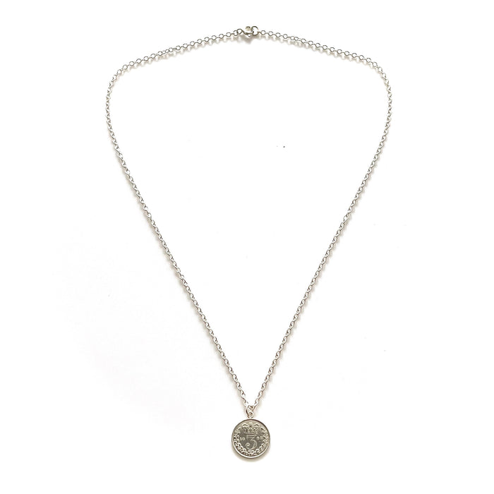 Chic sterling silver necklace featuring a historic 1885 British three pence coin
