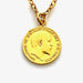Close-up of vintage gold plated 1904 threepence coin pendant