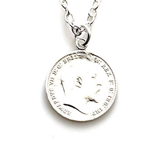 Close-up of 1907 Threepence sterling silver coin pendant