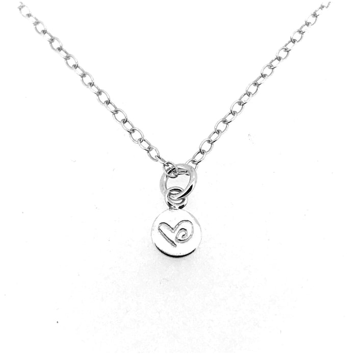 Close-up of Love Heart Necklace pendant with a detailed heart engraving by Roberts & Co