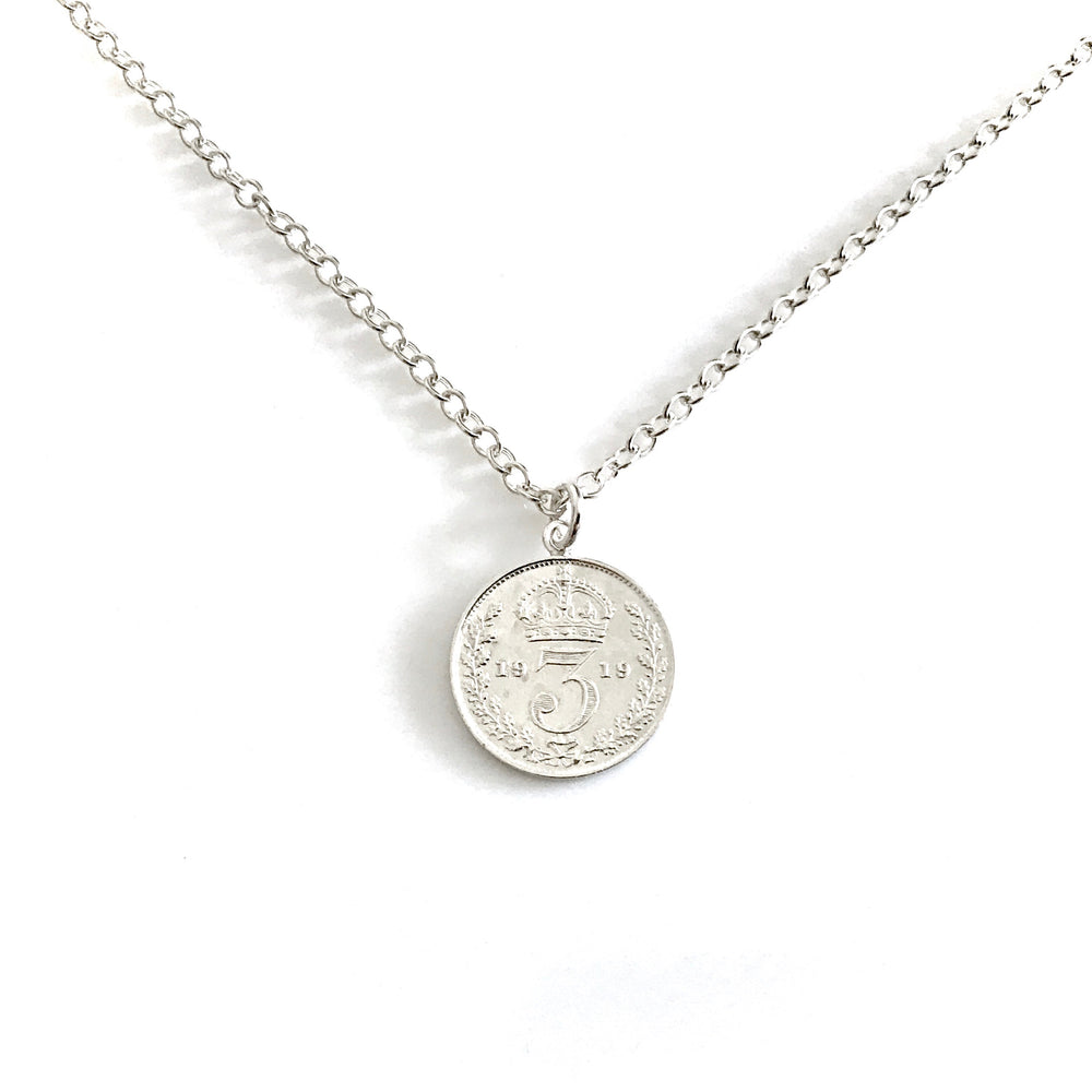 A genuine 1919 British threepence pendant on a sterling silver chain