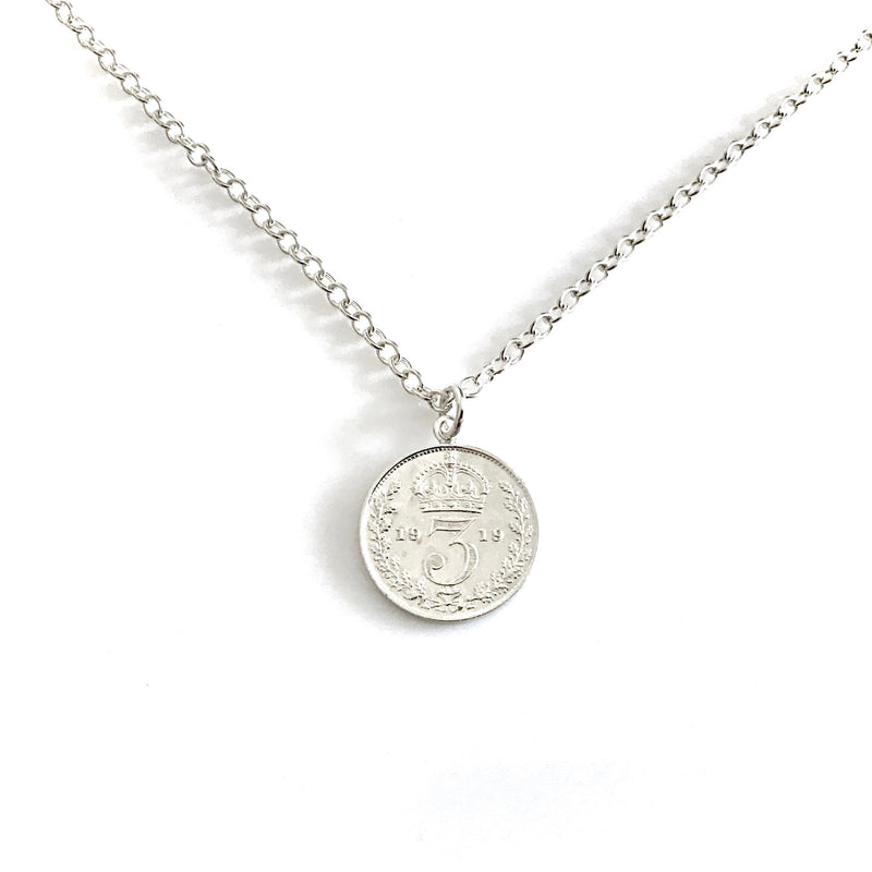 1919 British threepence pendant on a sterling silver chain, crowned three side facing forward.