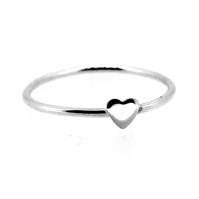 Close-up of the heart detail on a skinny silver stacking ring